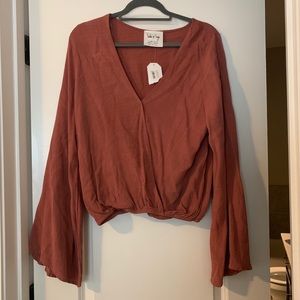 Burnt red wrap top with bell sleeves